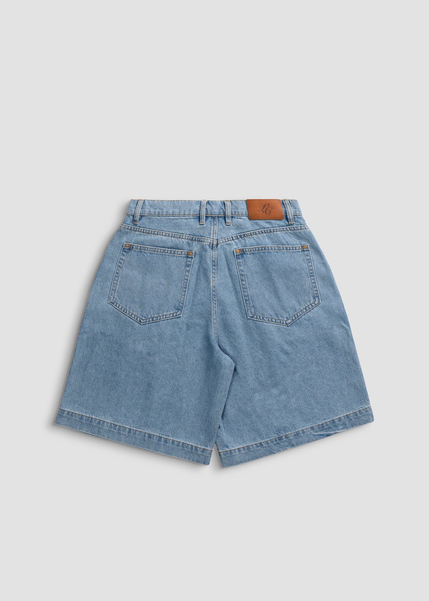 Wide Leg Pleated Shorts Denim. La Corsia Jorts 100% Cotton. Flat lay back
photography