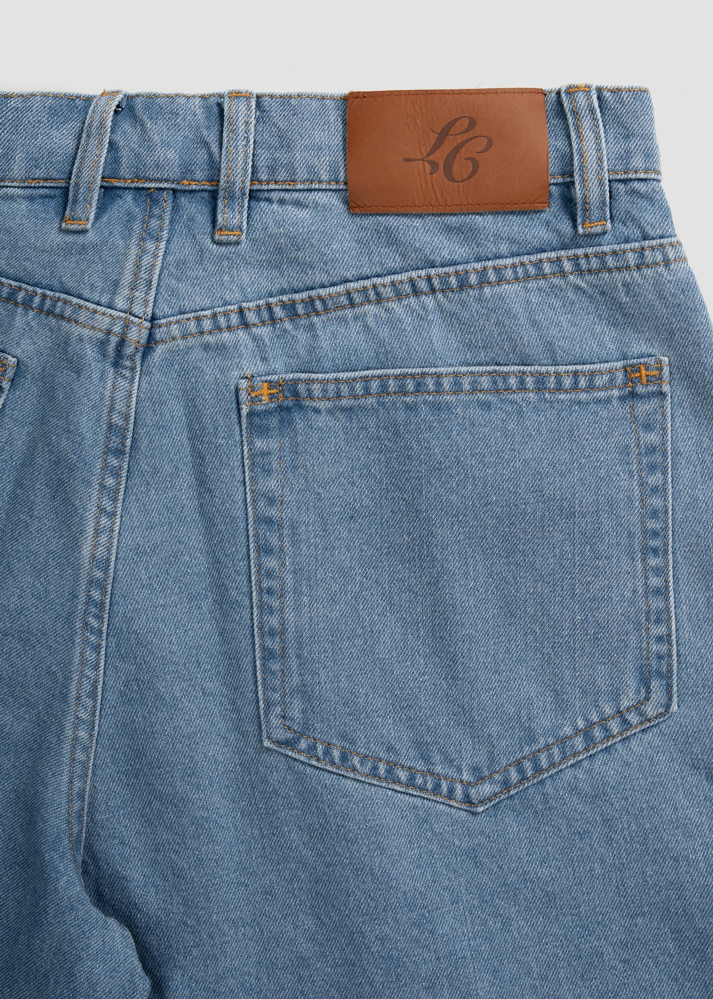 Wide Leg Pleated Shorts Denim. La Corsia Jorts 100% Cotton. Flat lay closeup back photography