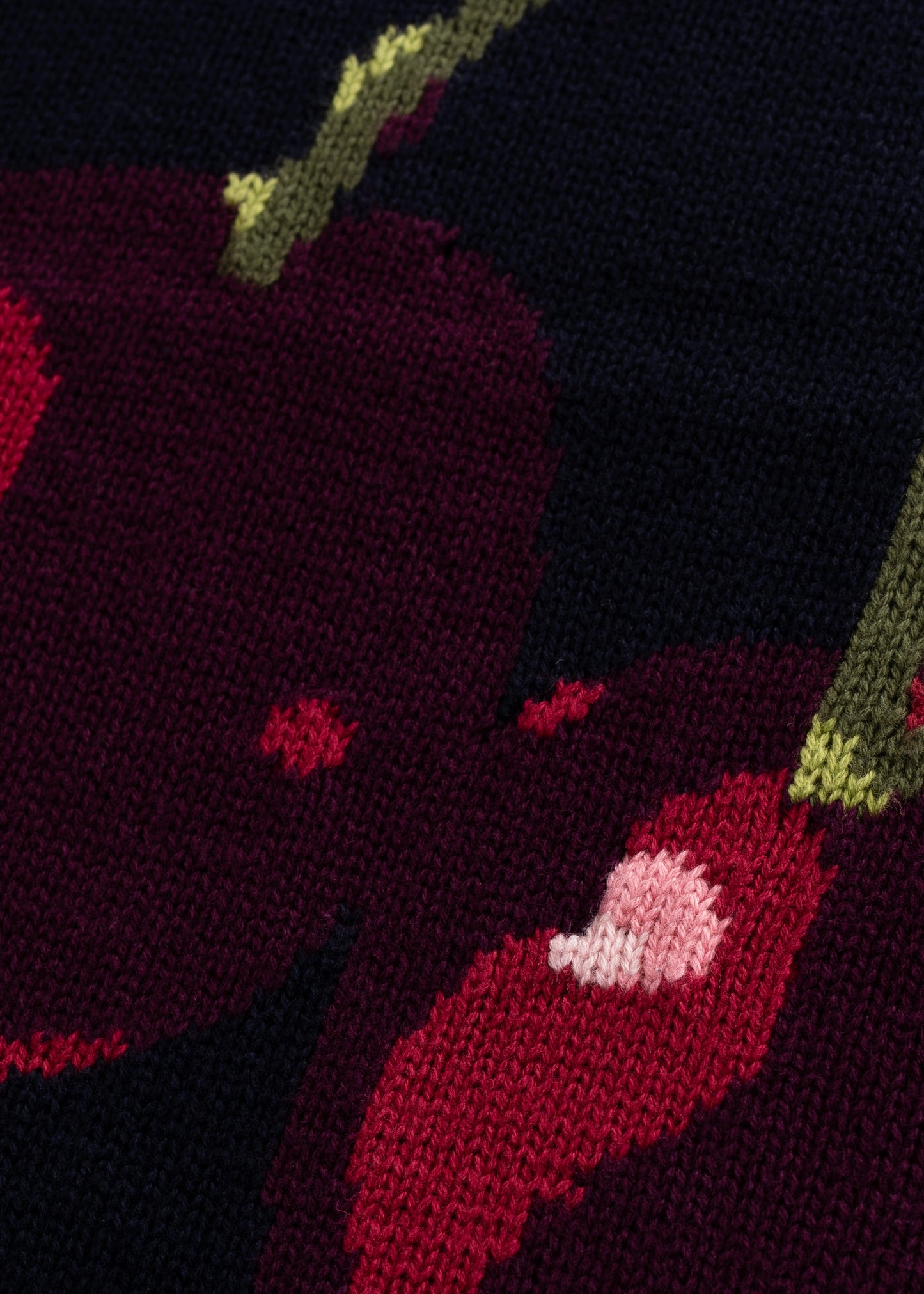 Closeup flatlay showing details of Intarsia Cherry Knit Design