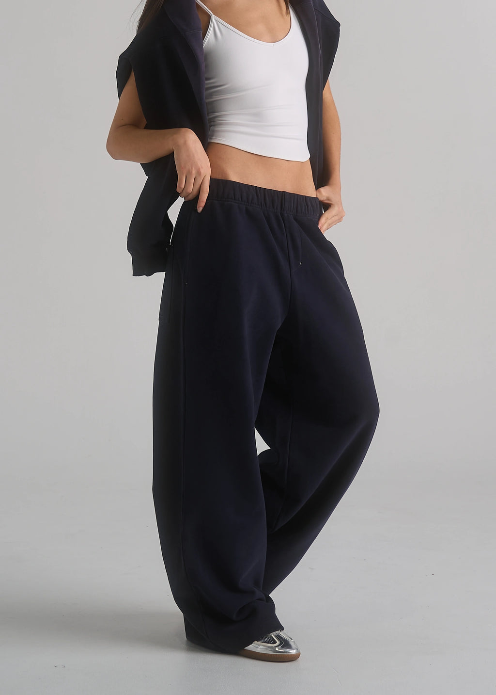 La Corsia Oversized Track Pant in washed navy, studio model shot