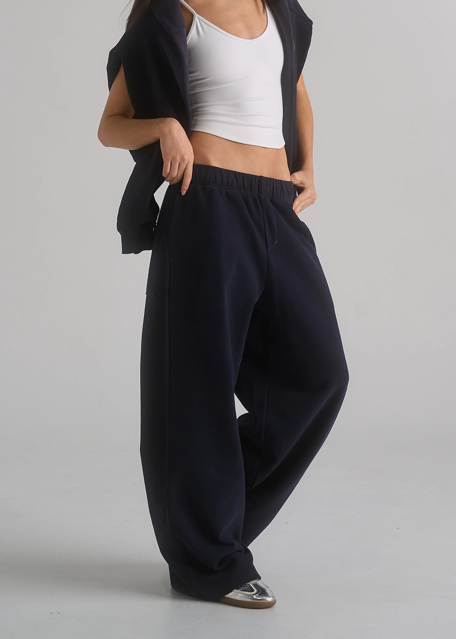La Corsia Oversized Track Pant in washed navy, studio model shot