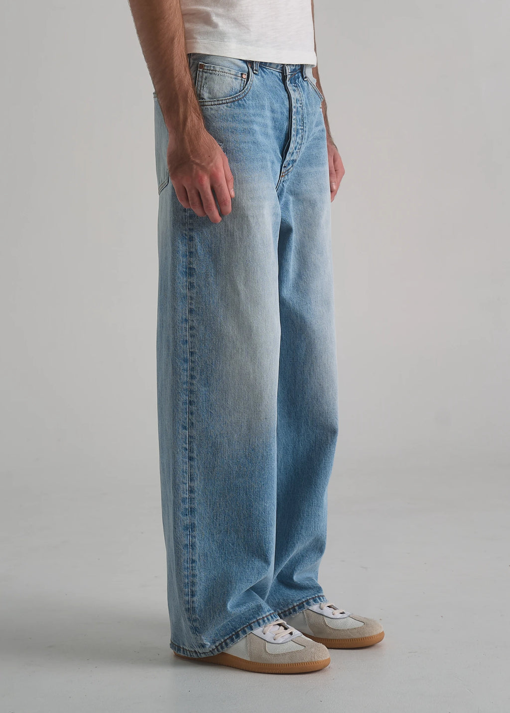 Model wearing the La Corsia Vintage Wash Relaxed Denim in light blue