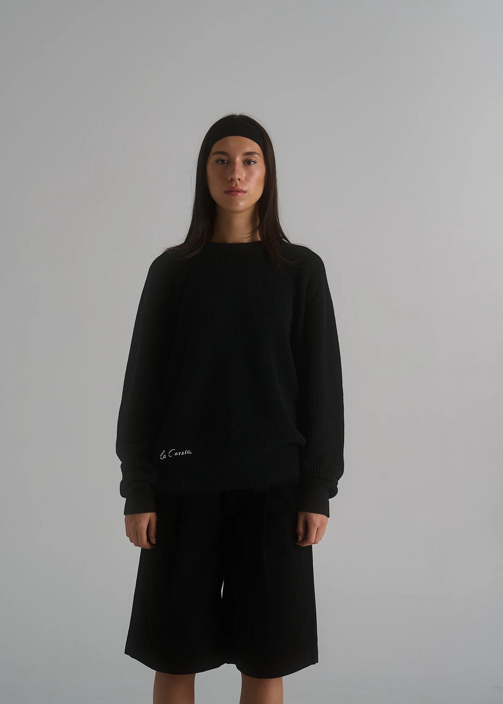 La Corsia Cotton Fisherman Sweater in black, studio model shot
