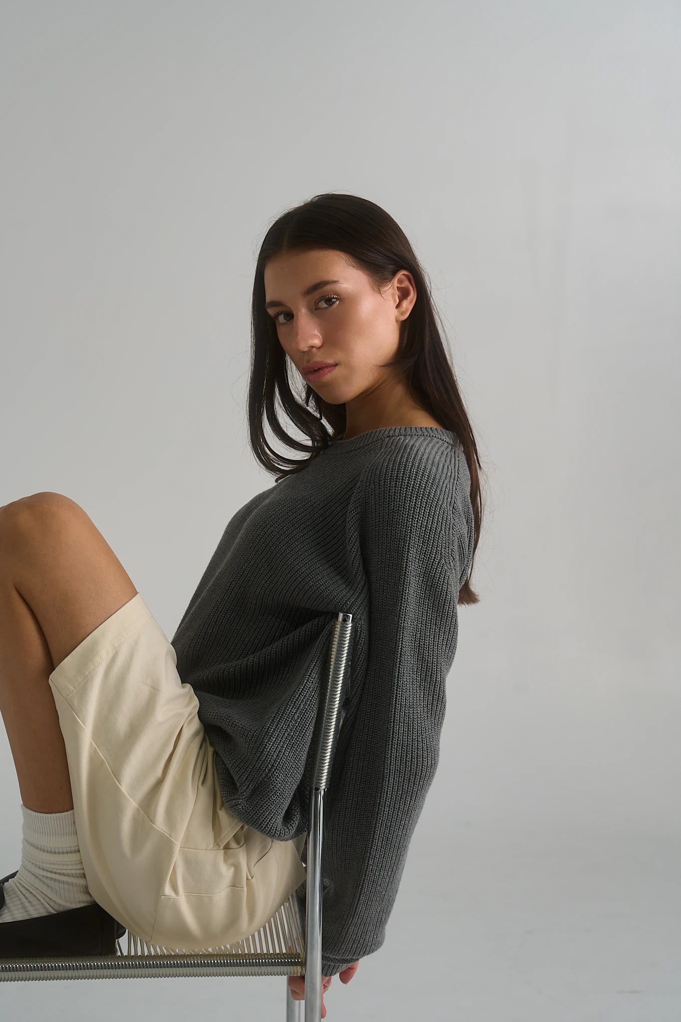 Model wearing the La Corsia Cotton Fisherman Sweater in grey marle