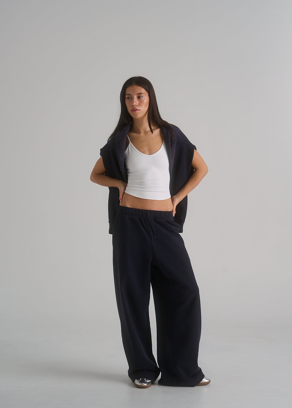 La Corsia Oversized Track Pant in washed navy worn by a model on a plain studio background