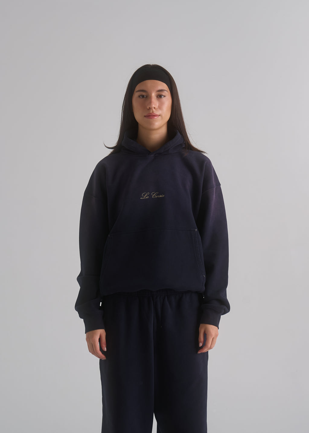La Corsia Washed Script Hoodie in washed navy, studio model shot