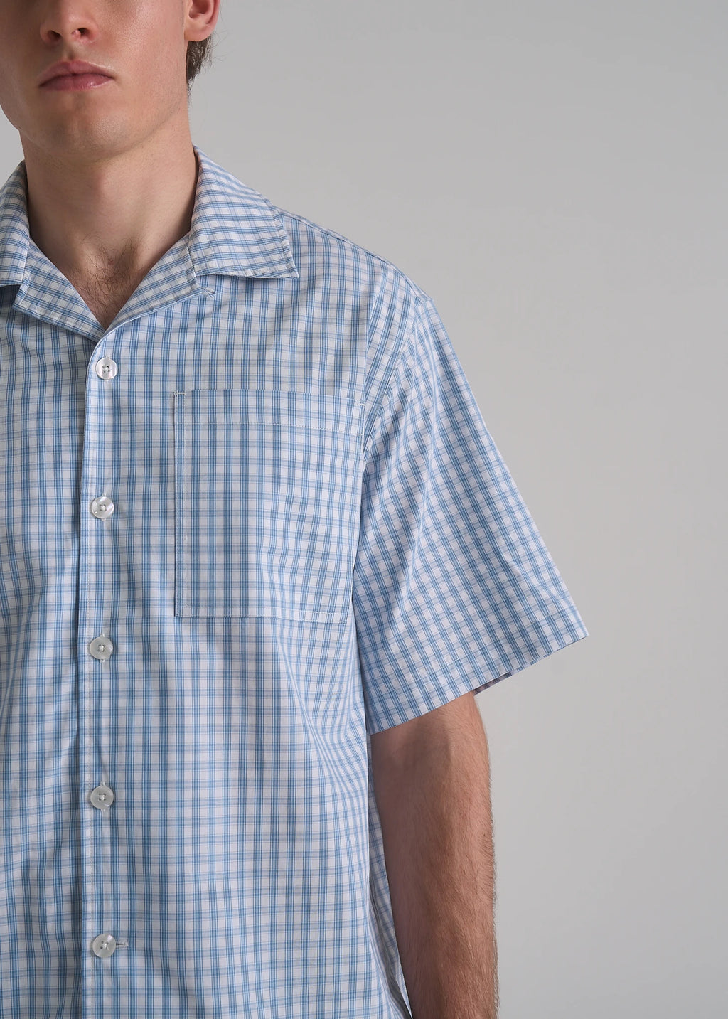 La Corsia Oversized Short Sleeve Shirt in light blue plaid, studio model shot