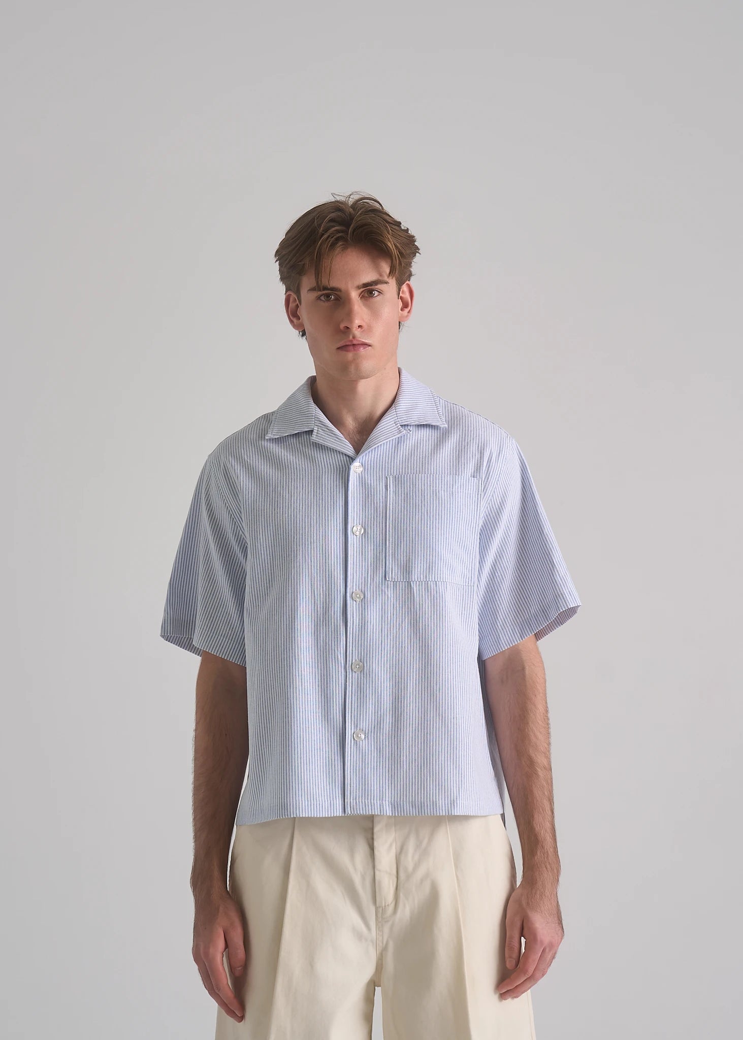 La Corsia Oversized Short Sleeve Shirt in oxford stripe, studio model shot