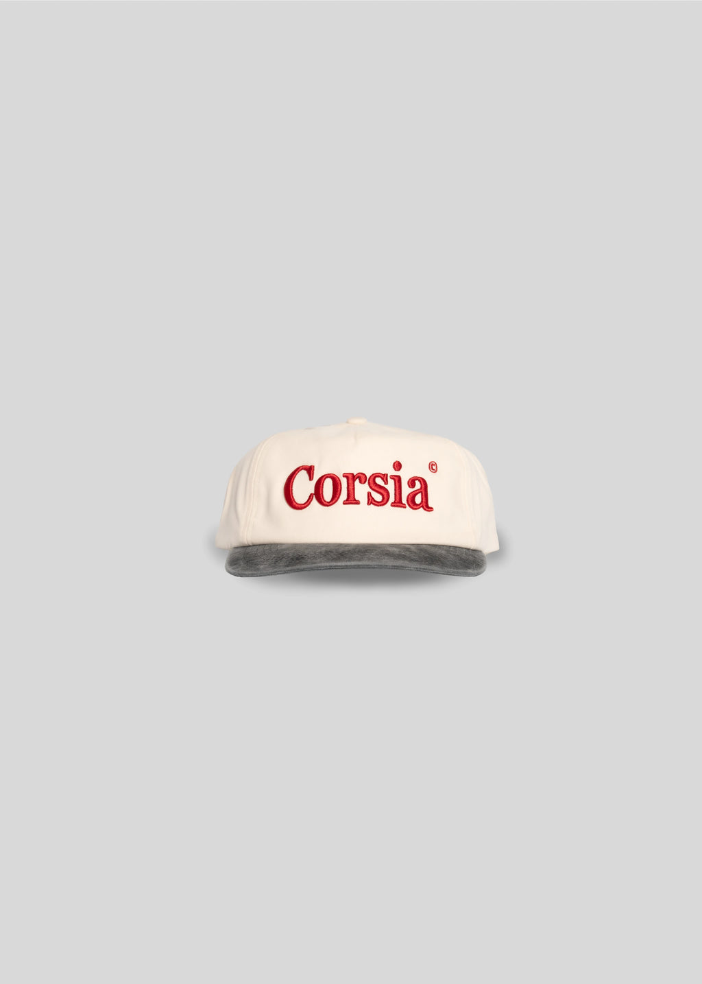 White cap with 'Corsia' logo on a gray background