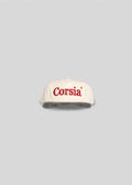White cap with 'Corsia' logo on a gray background