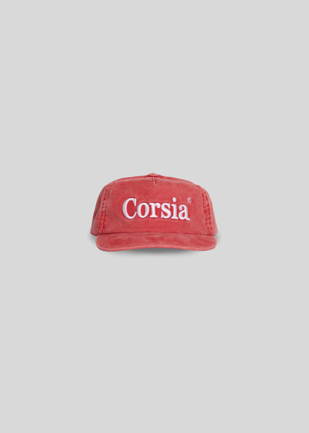 Red cap with 'Corsia' text on a light gray background