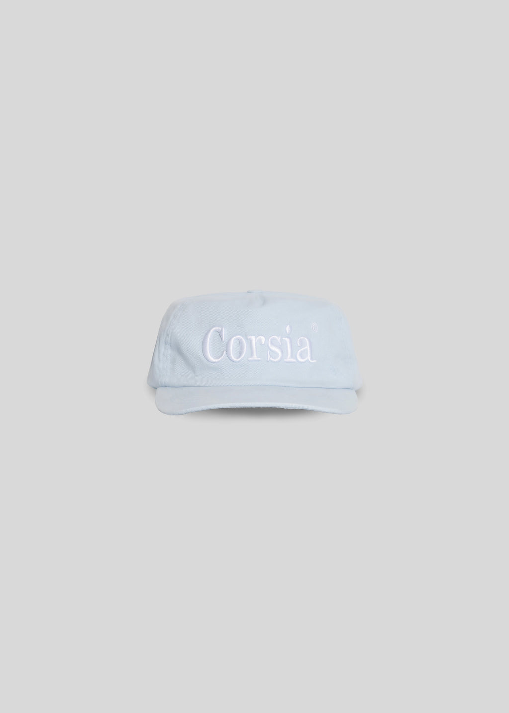 Light blue visor cap with 'Corsia' branding on a light gray background