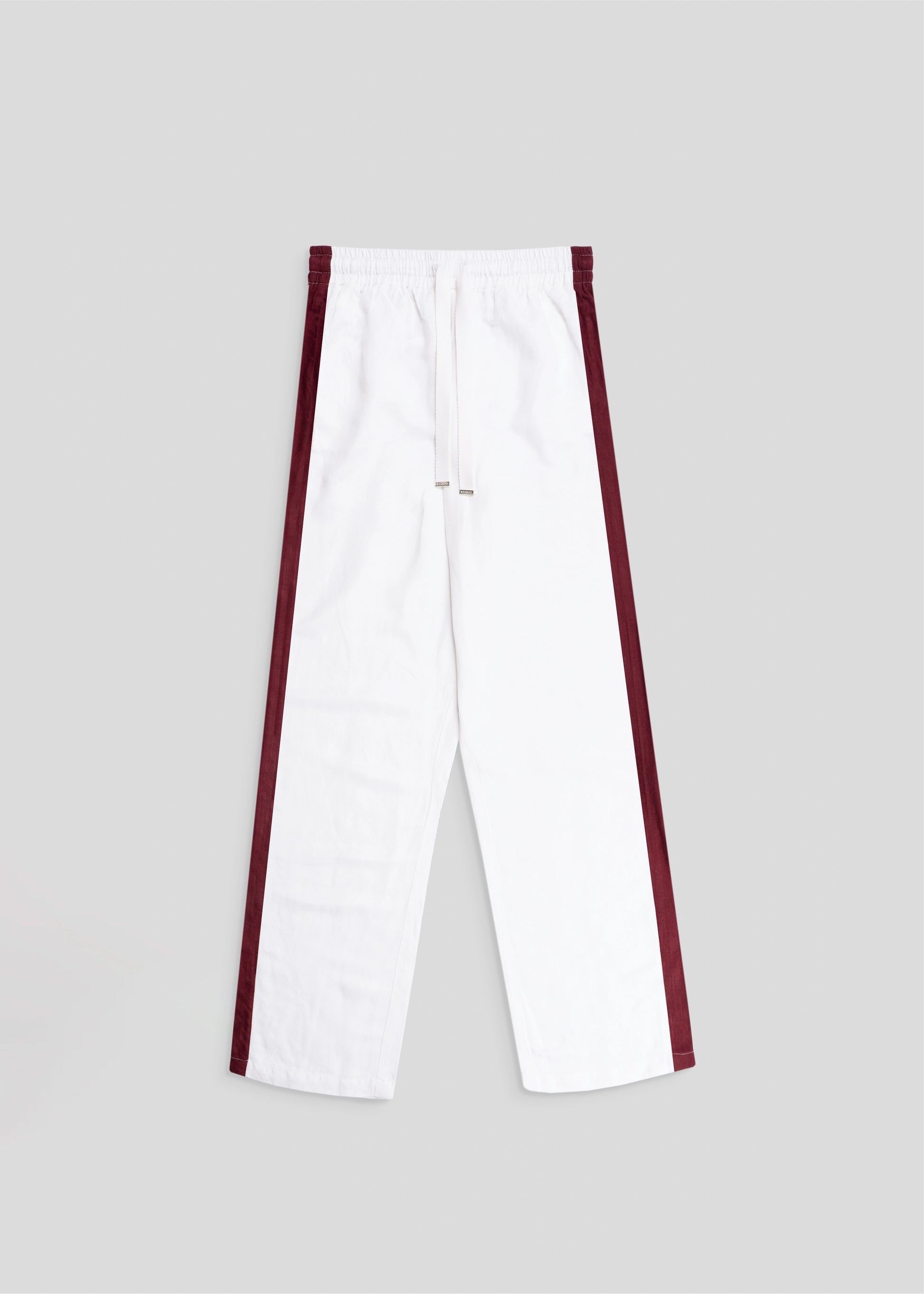 Flat lay details of straight leg side seam pant in white and merlot.