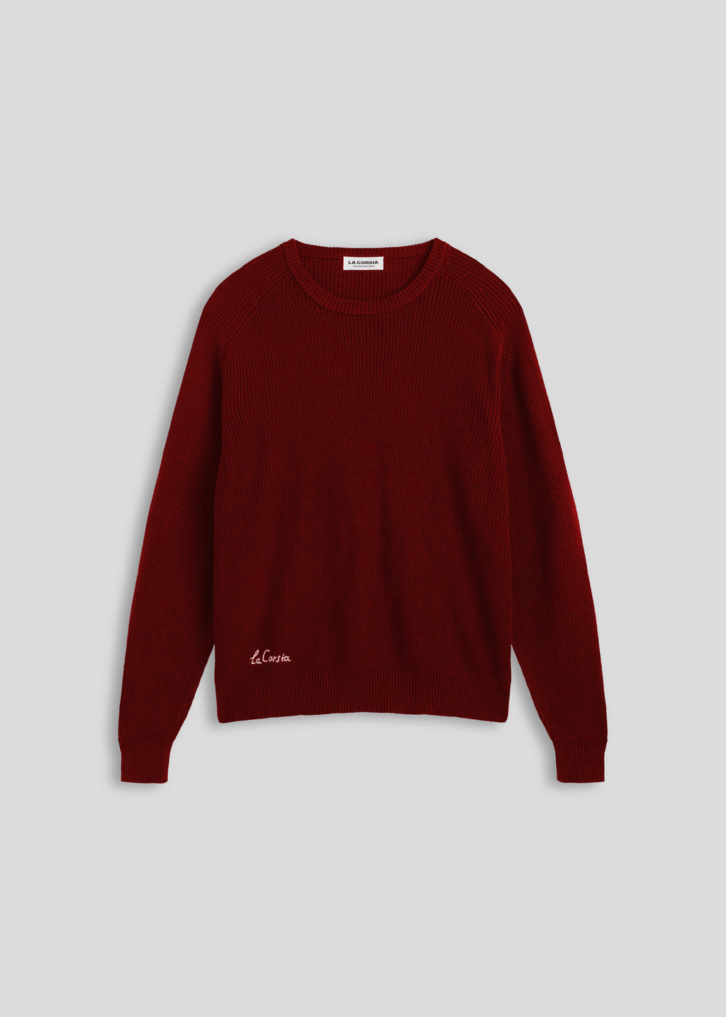 La Corsia Cotton Fisherman Sweater in wine red, flat lay on a plain background