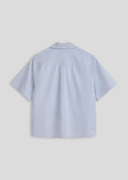La Corsia Oversized Short Sleeve Shirt in oxford stripe, product flat lay on a plain background