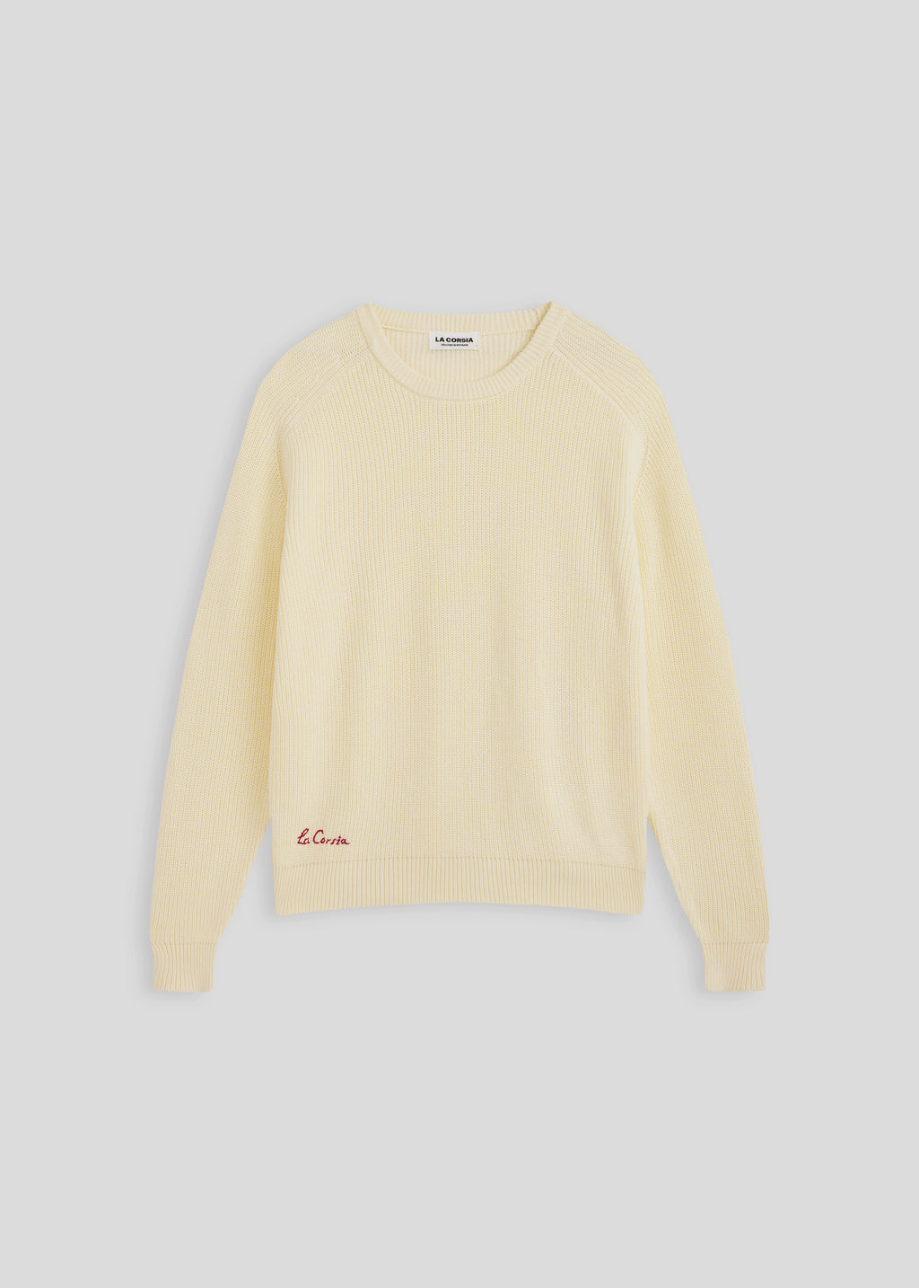 La Corsia Cotton Fisherman Sweater in cream, flat lay on a plain background