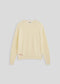 La Corsia Cotton Fisherman Sweater in cream, flat lay on a plain background