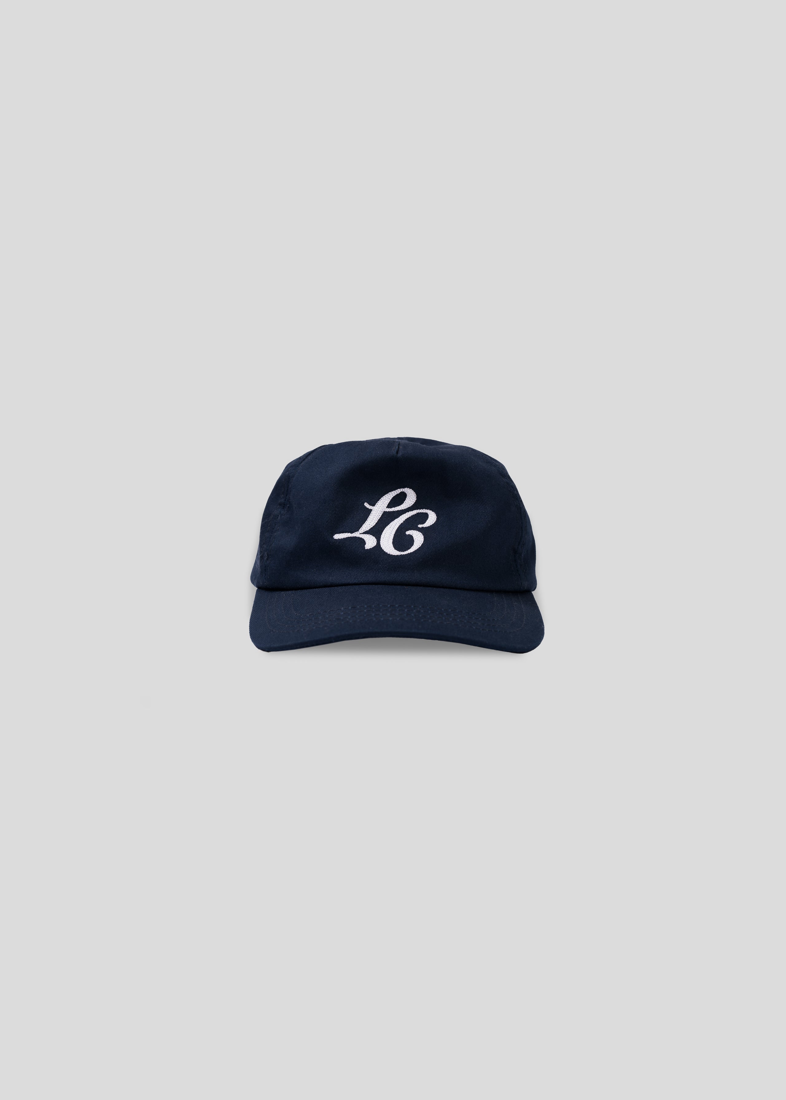 Flat lay studio image of Navy Monogram Cap with Embroidery.