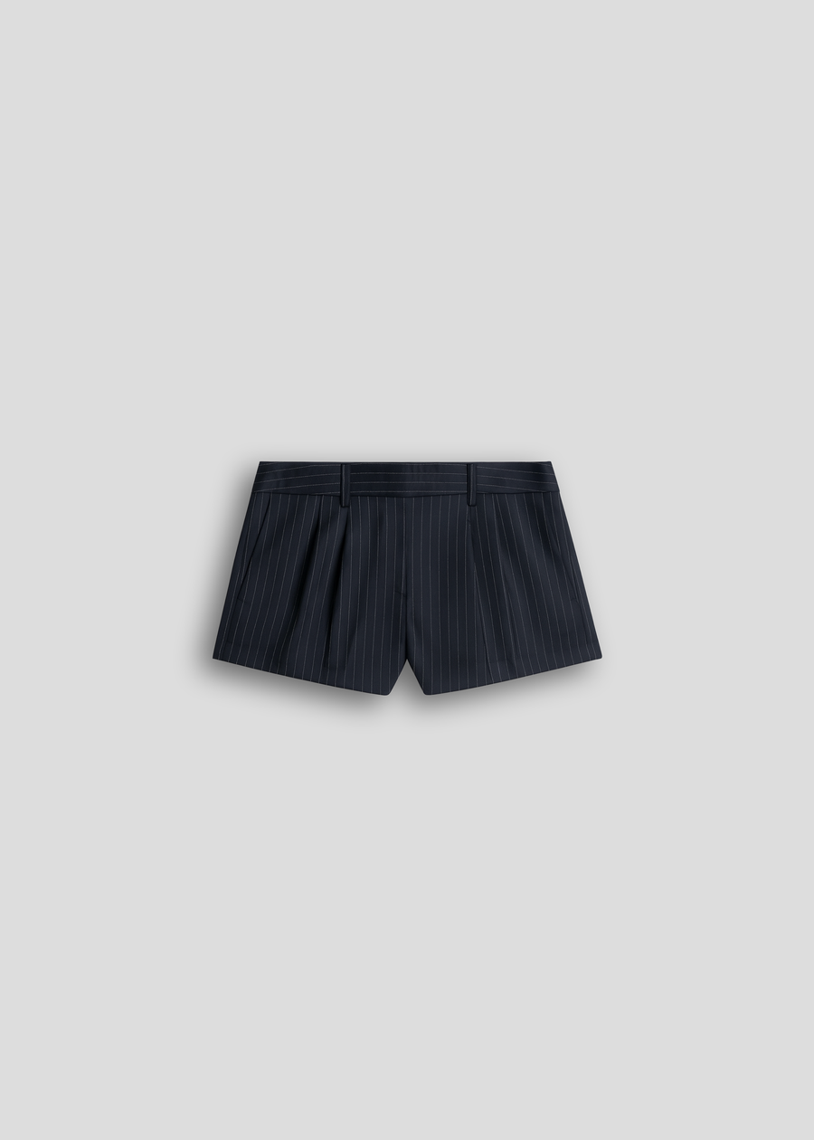 Model wearing the La Corsia Tailored Wool Mini in navy pinstripe