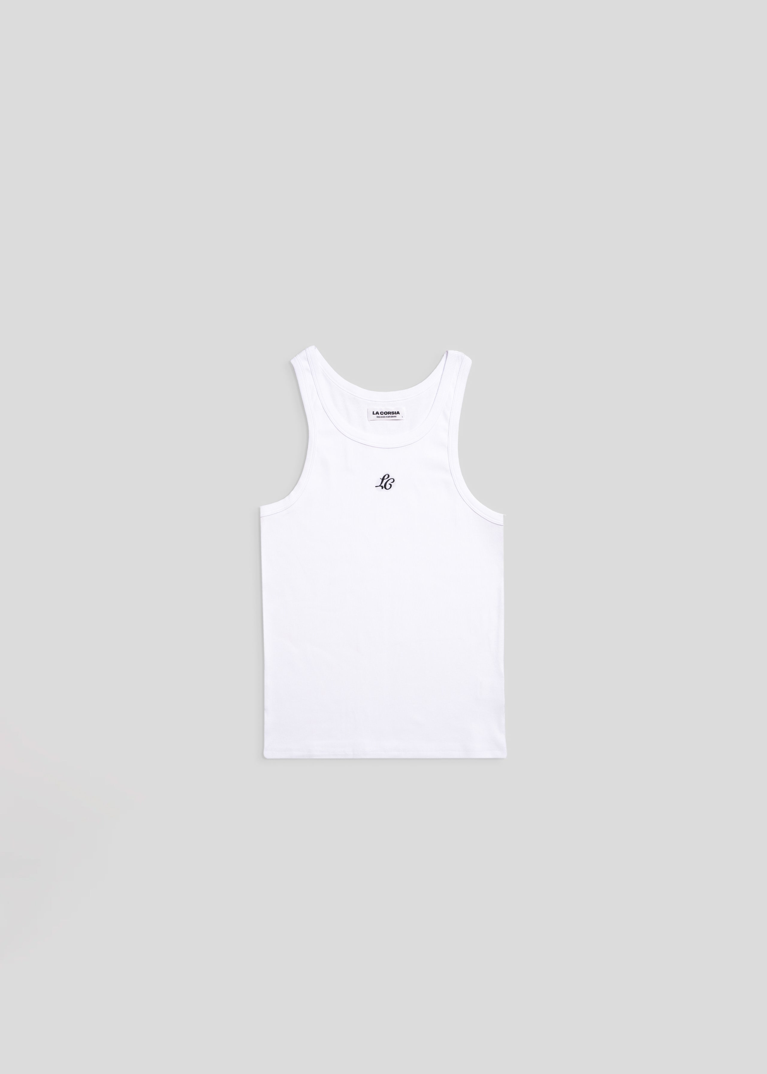 Flat lay of embroidered white monogram tank top by La Corsia, ribbed cotton singlet with LC embroidery