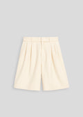 Beige wide leg pleated shorts from La Corsia on a light gray background